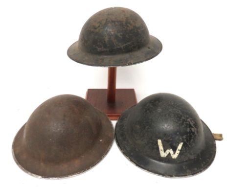 Three WW2 Pattern MKII Steel Helmets consisting black painted helmet. &nbsp;Black treated linen liner .... Khaki painted helm