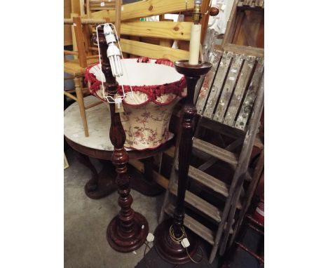 Two floral carved mahogany standard lamp of baluster form