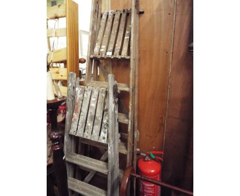 Two sets of wooden step ladders 