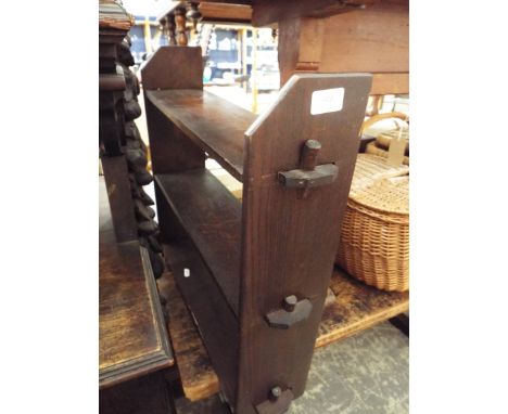 An oak wall hanging three shelf bookcase