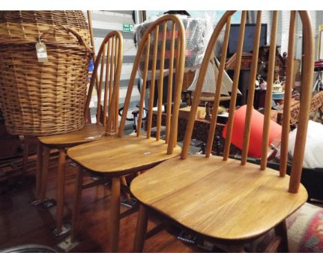 A set of four Ercol dining chairs