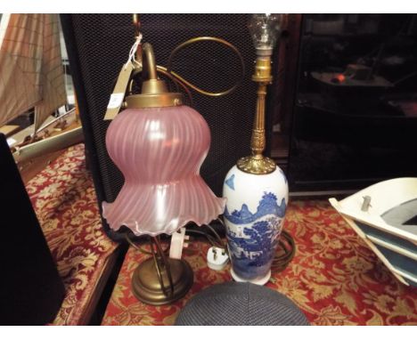 A Georgian style brass rise and fall table lamp with pink glass shade together with Chinese vase table lamp