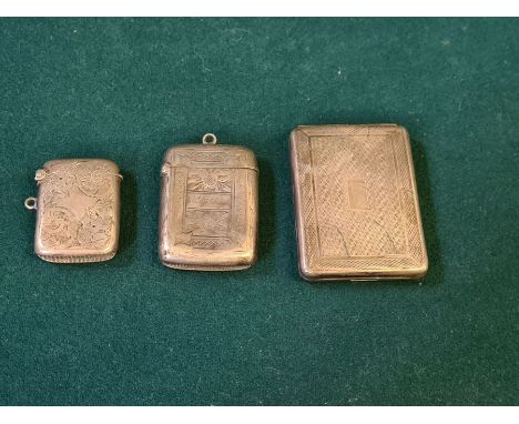 Silver engine turned matchbook holder, Birmingham 1936 by S.J. Levi &amp; Co. and 2 silver vesta cases, 68g.