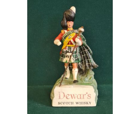 A counter top composition Dewar's White Label Scotch Whisky advertising figure.