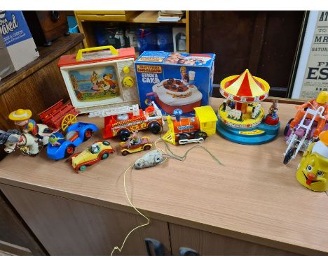 A box lot of vintage 1970's toys including Fisher Price t.v. and fire engine, Matchbox Stack a Cake, Corgi Magic Roundabout, 