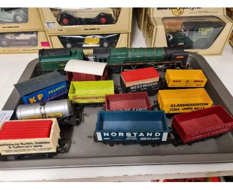 Hornby Britannia loco and tender together with various Hornby and Lima rolling stock.