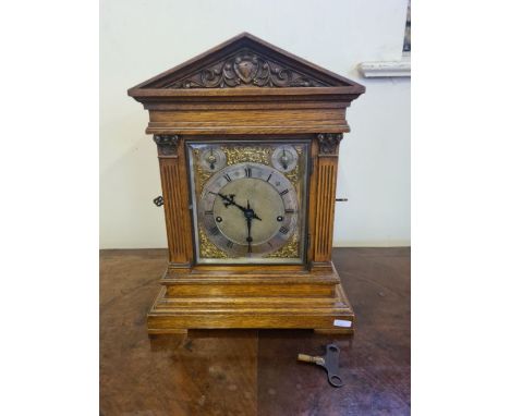 An oak cased Winterhalder &amp; Hofmeier bracket clock with quarter chiming movement, brass dial with spandrels and silvered 