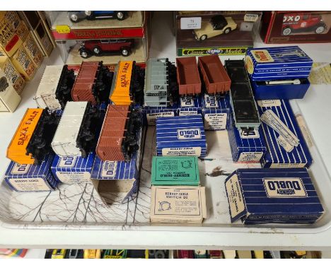 A tray of boxed Hornby Dublo rolling stock and accessories including switches, light signals, buffers, stops, etc.