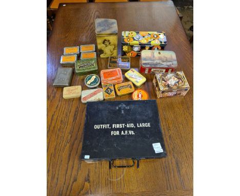 A WWII army armoured fighting vehicle, first aid kit and contents together with a small collection of advertising tins.