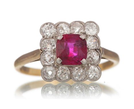 RUBY AND DIAMOND RING  set with central cushion cut ruby within a halo of old cut diamonds, marked 18CT & PLAT, size K  Qty: 