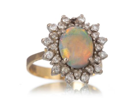 OPAL AND DIAMOND CLUSTER RING  set with an oval cabochon opal within a diamond halo, in eighteen carat gold, size O  Qty: 6.3