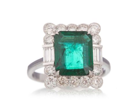 EMERALD AND DIAMOND RING set with an emerald of approximately 3.58 carats, within a diamond halo totalling approximately 1.03