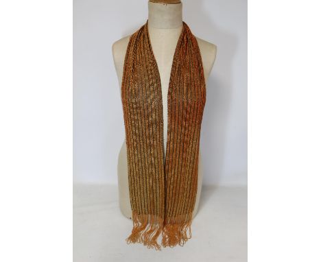 1920's flapper scarf or sash, with coral and amber glass beadwork and fringing and black mesh back. 163cm x 14cm. 