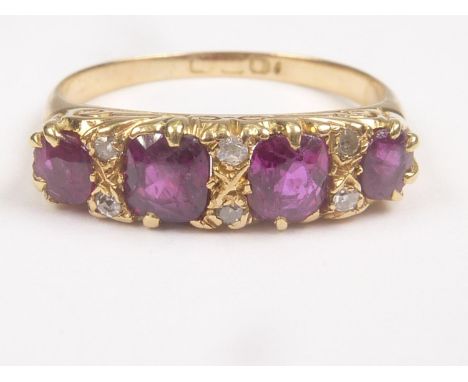 Ruby four stone ring with tiny diamond brilliants in 18ct gold, 19th Century.&nbsp;Size 'K 1/2'. 