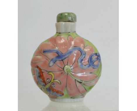 Chinese porcelain snuff bottle of moonflask form decorated with polychrome butterflies and lotus, jade stopper, 7cm high.&nbs