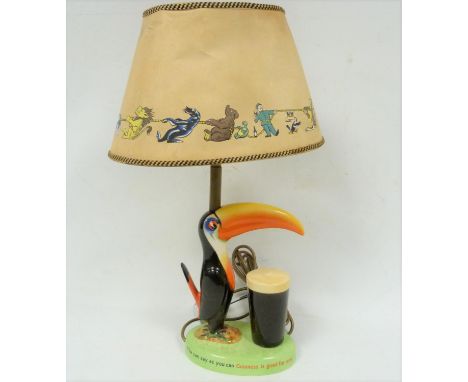 Carlton Ware&nbsp;Guinness&nbsp; 'Toucan &amp; Pint' table lamp on green base with the words 'How grand to be a Toucan, just 