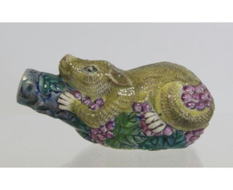 Chinese porcelain polychrome snuff bottle in the form of a squirrel with grapes, lacking stopper. 7.5cm long. 