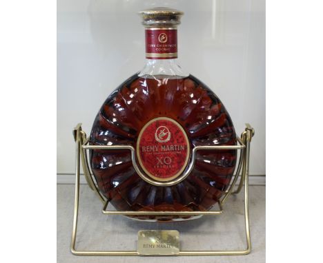 Remy Martin Fine Champagne Cognac XO Special, 3 litres, in glass decanter bottle on brass swivel stand.