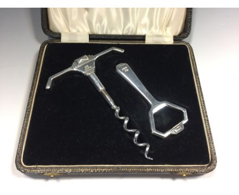 A cased Art Deco silver corkscrew and bottle opener by William Suckling Ltd., Birmingham 1941, with stepped handles  
