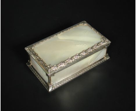 A George VI mother-of-pearl mounted silver casket by Omar Ramsden, London 1937, the lid and four side panels each from solid 