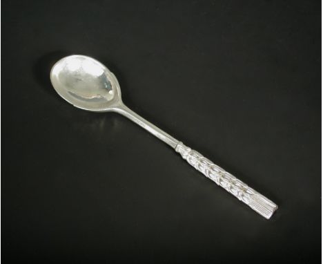 A George V silver preserve spoon by Omar Ramsden, London 1931, the upper stem cast as barley ears above a planished bowl, 2.1