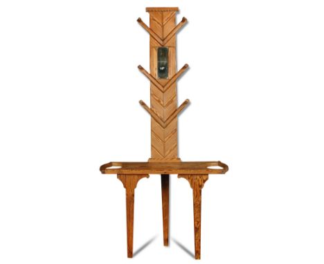 A pitch pine hall stand, the top with central rectangular mirror and six pegs on chevron supports, the base stick stand to ei