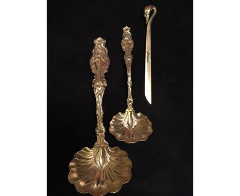 Two American sterling silver Whiting Lily sauce ladles in the Art Nouveau style, marked indistinctly 'Geo.... & Co', 105.5g a