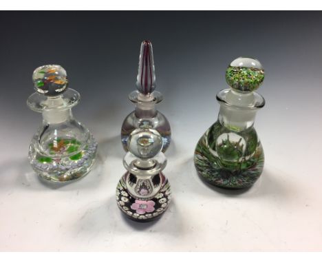 Three Caithness glass bottles and stoppers, including a Caithness Elizabeth of Glamis rose bottle, a smaller Rose P/B bottle,