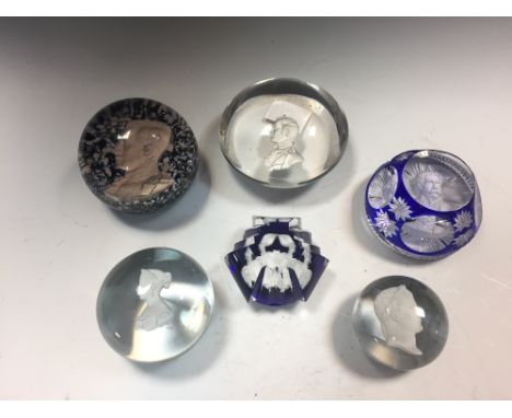 A collection of six sulphide glass paperweights, including a small antique French weight with a bust of Napoleon after Andrie