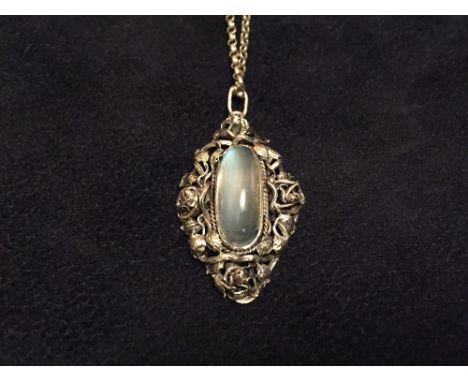 An Art Nouveau style moonstone necklace, the deep oval cabochon, approx. 22mm long, set in a handmade collet mount and surrou