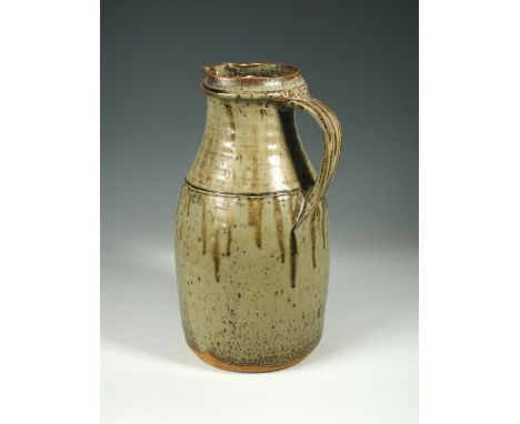 § Richard Batterham (British, born 1936) a large stoneware jug, with applied strap handle, covered in an ash glaze, unsigned 