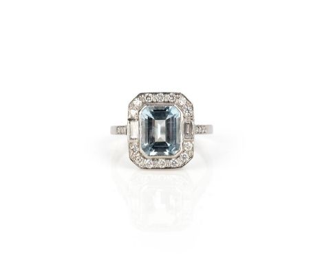 An aquamarine and diamond ring, of cluster design, set with a step-cut aquamarine weiging 1.80 carats, to a border and should