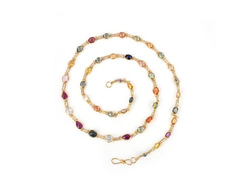 A gold, sapphire and ruby necklace, designed as a fine chain spectacle-set with oval and pear-shaped multicoloured sapphires 