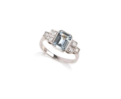 An aquamarine and diamond ring, the step-cut aquamarine set within diamond-set shoulders in platinum, size M 1/2