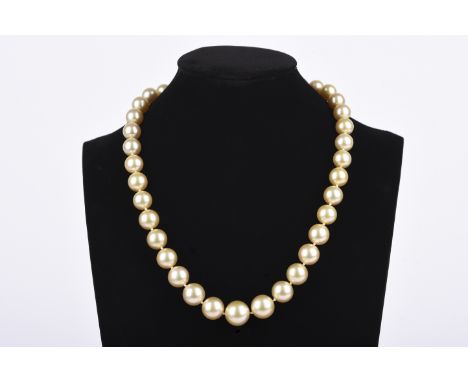 A South Sea cultured pearl necklace, designed as a single strand of graduated cultured pearls of yellow tint, measuring appro