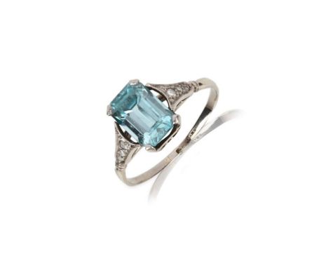 A zircon and diamond ring, mid 20th century, claw-set with a step-cut blue zircon, to shoulders set with rose-cut diamonds, m