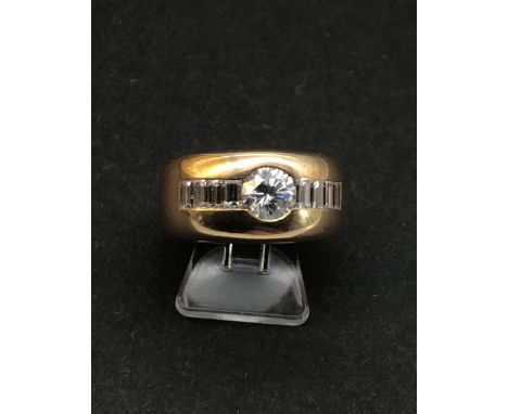 Exner, Goldschmiede, Recklinghausen: Bandring mit zentr. Brillant ca. 0,7ct, mit flank. Baquettedia.schwerer Ring aus 750er G