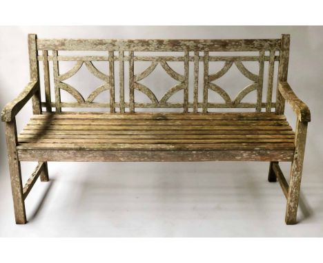 GARDEN BENCH, weathered teak of slatted form with lattice back, 150cm W.