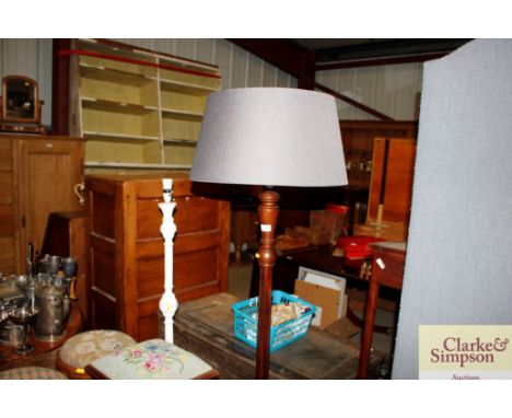 A mahogany standard lamp and shade; and a white painted standard lamp