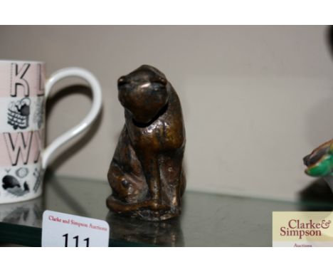 A bronze cat ornament