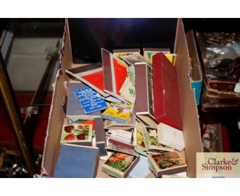 A collection of various vintage match boxes and match box covers 
