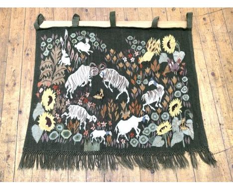 A wool tapestry, 20th century, possibly work created at Dovecot Studios, Edinburgh, worked in coloured wools with butting ram