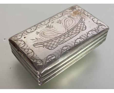 A Dutch silver snuff box, c. 1800, with bright-cut decoration of a stylised basket of flowers to the hinged cover over a body