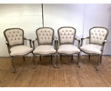 A set of four fauteuils by Coach House, of 18th century design, with stained wooden frames, the button back, open arms and ov