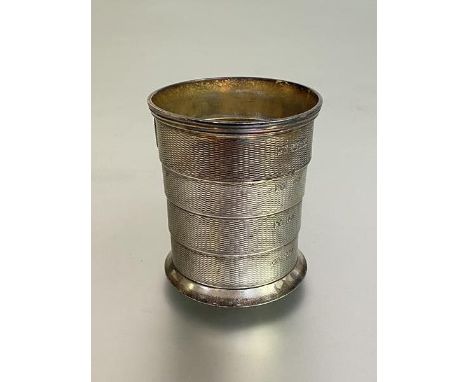 A Victorian engine-turned silver telescopic travelling stirrup cup or beaker, Robert Harper, London 1874, the oval cartouche 