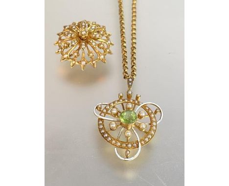An Edwardian 15ct gold peridot and seed pearl pendant, further decorated with white enamel (losses to enamel), the round-cut 