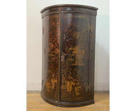 An 18th century Japanned bow fronted hanging corner cupboard, with gilt Chinoiserie and simulated tortoiseshell decoration, t