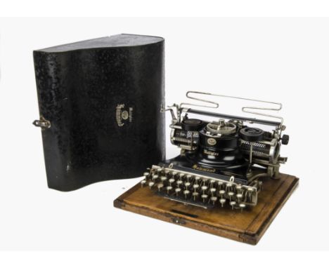 Typewriter: a Hammond Multiplex typewriter, with one typesleeve, on wood baseboard with steel cover