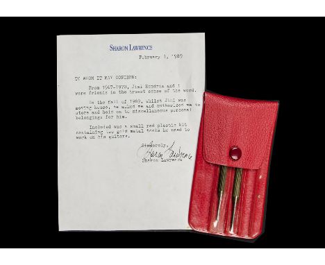 Jimi Hendrix:  two gold coloured precision screwdrivers housed in a red plastic wallet which he used to work on his guitars, 