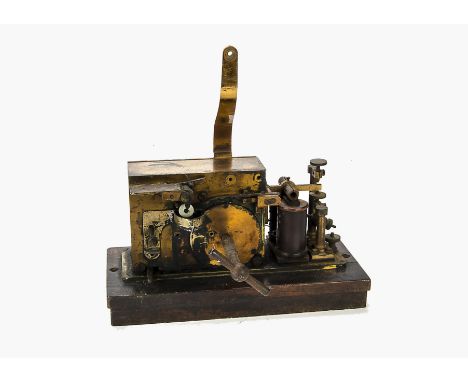 Morse recorder: with spring motor, in lacquered brass housing with winding key and bracket for spool, on wood base (no name o